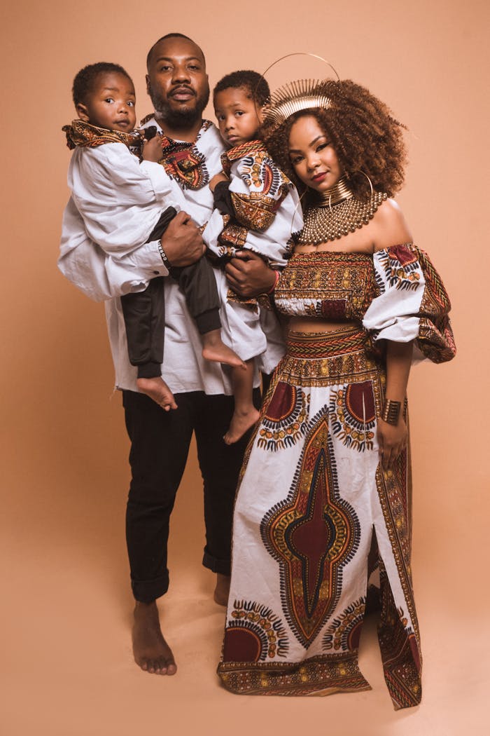 Elegant family portrait showcasing traditional African clothing style and vibrant patterns.